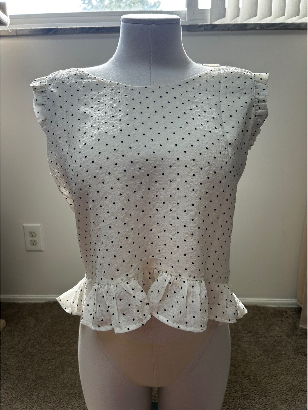 Pleione Women's White Sleeveless Polka Dot Blouse with Ruffled Sleeves and Hem,